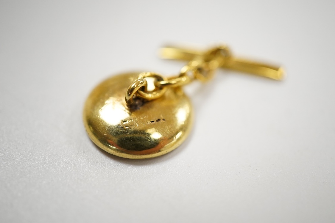 A pair of yellow metal (stamped 18) mounted, mother of pearl and diamond set disc cufflinks, diameter 12mm, gross weight 5.2 grams.